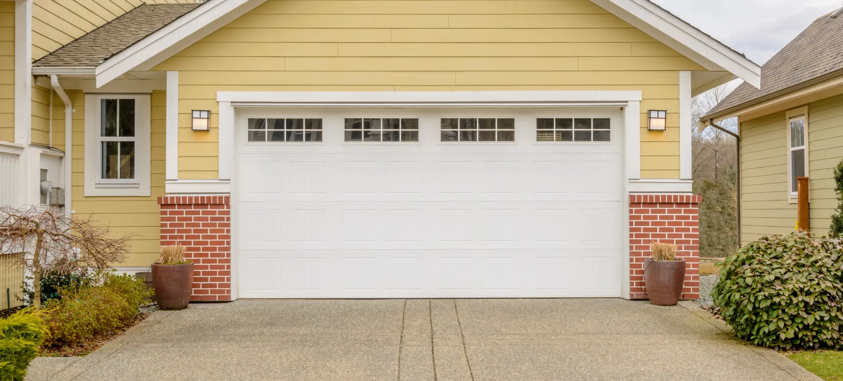 Before garage conversion ADU Dallas TX project showing existing garage door before conversion into private living suite by America ADU