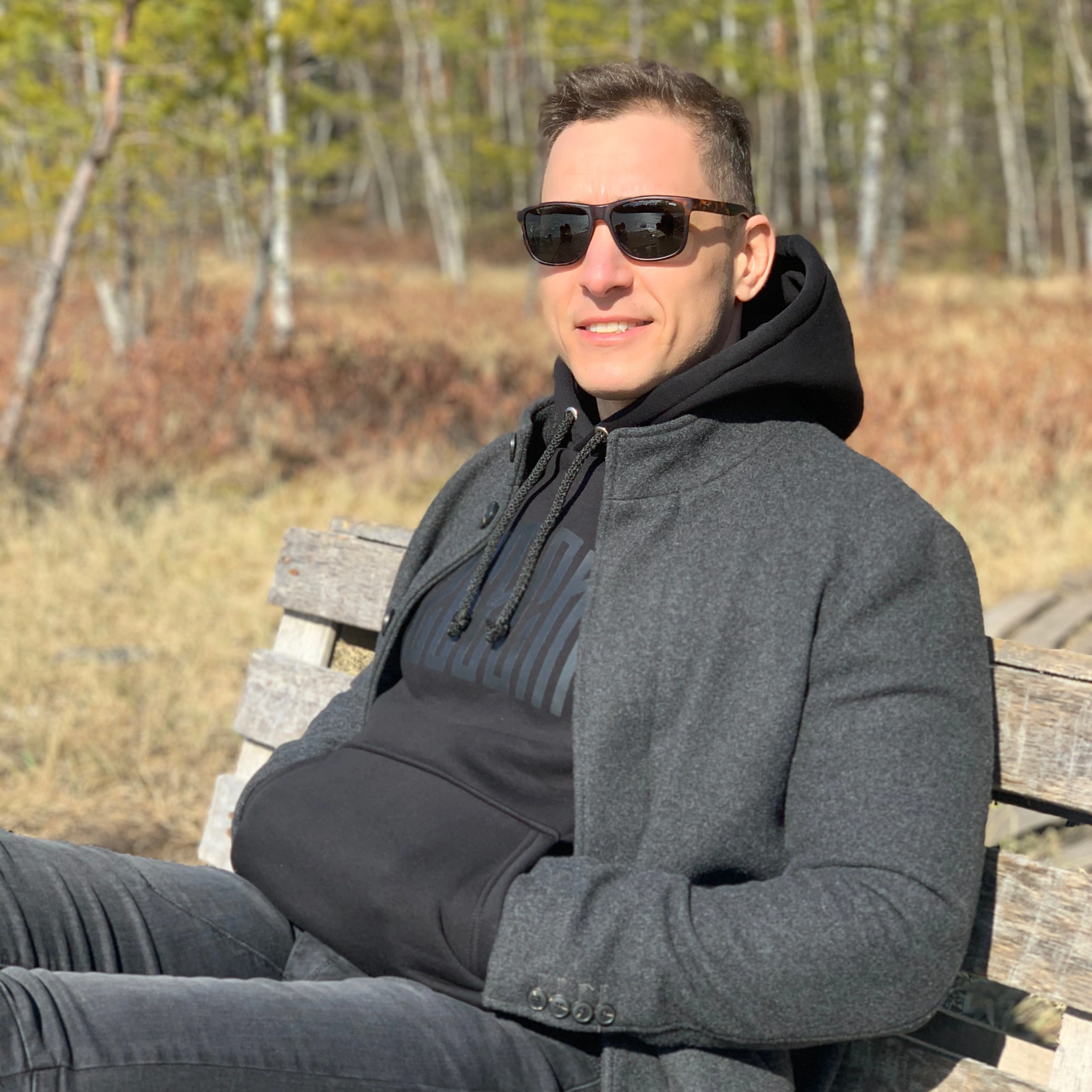 Satisfied male homeowner relaxing outdoors representing successful projects completed by America ADU