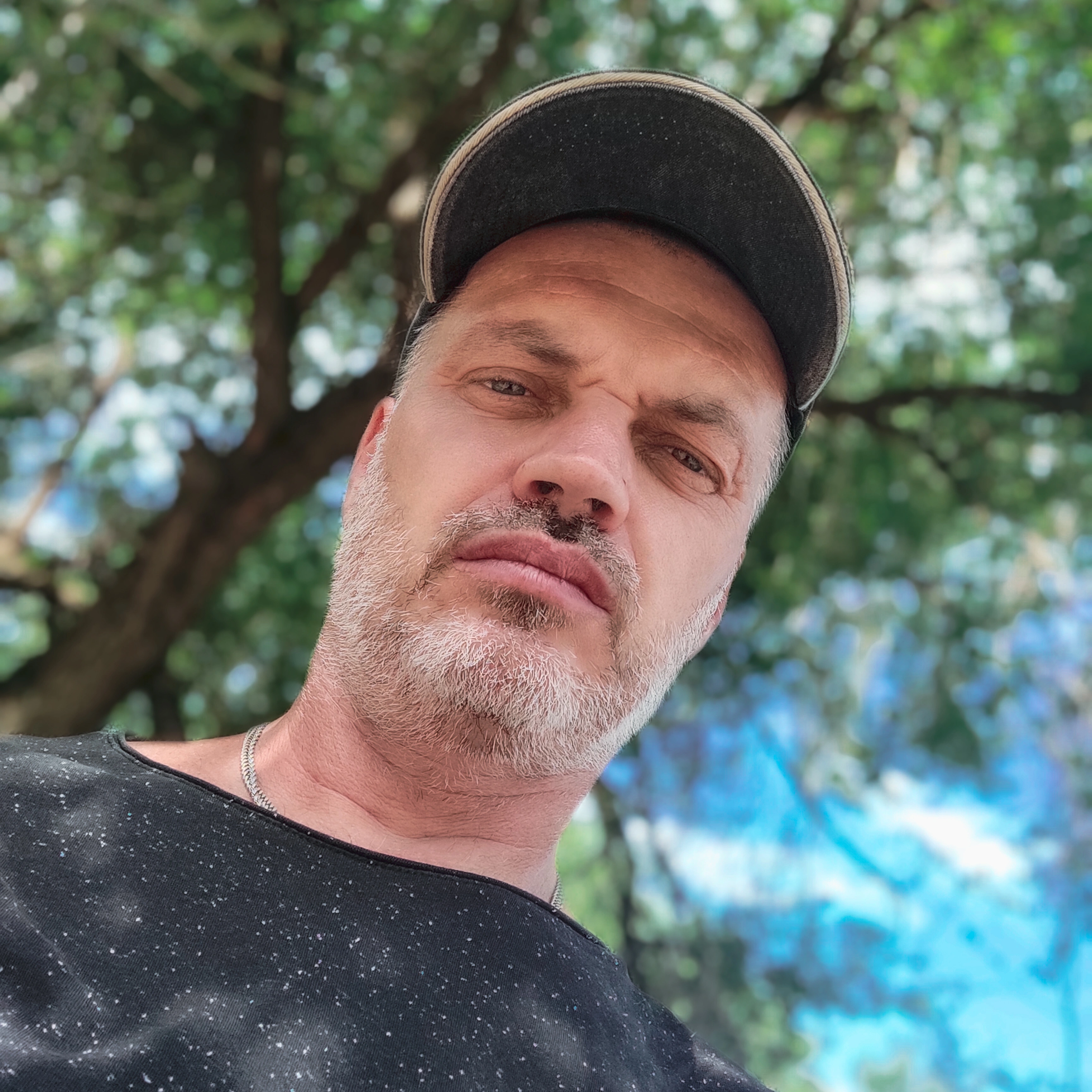 Happy homeowner carrying backpack representing clients satisfied with America ADU projects