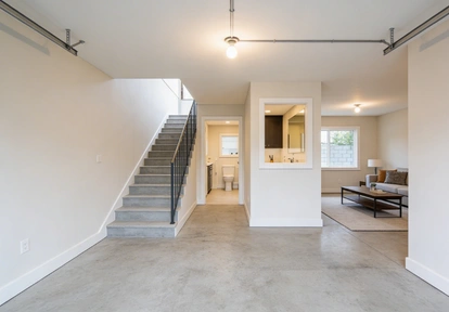 open basement ADU living space with stairs and modern interior by America ADU